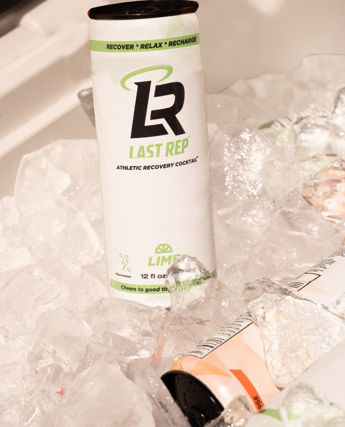 Reaching into a cooler full of ice for a Last Rep Lime can